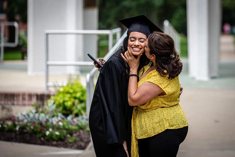 A Northwest graduate shares a moment with a loved one before the University's commencement ceremony last spring. Northwest hosts its 2021 spring commencement ceremonies May 6-8. (Photos by Todd Weddle/Northwest Missouri State University)